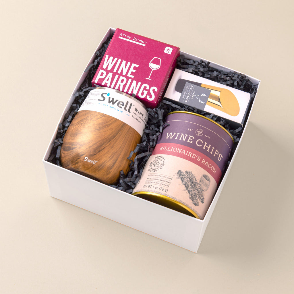 Unique gift for wine lovers with wine tumbler, wine trivia, wine chips and a bottle stopper.
