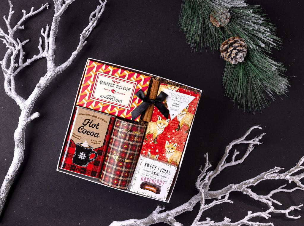 Modern festive holiday gift with trivia game and artisanal treats