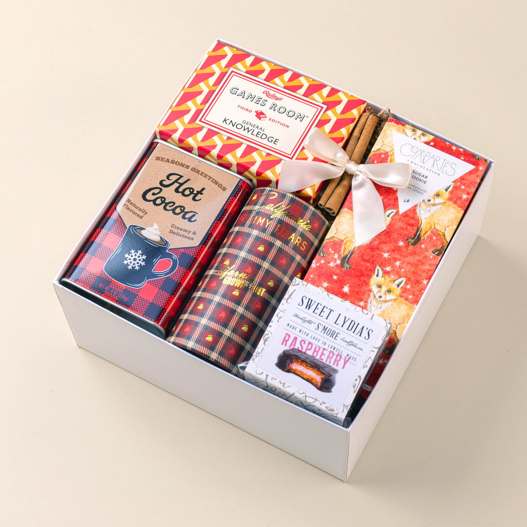 Modern festive holiday gift with trivia game and artisanal treats