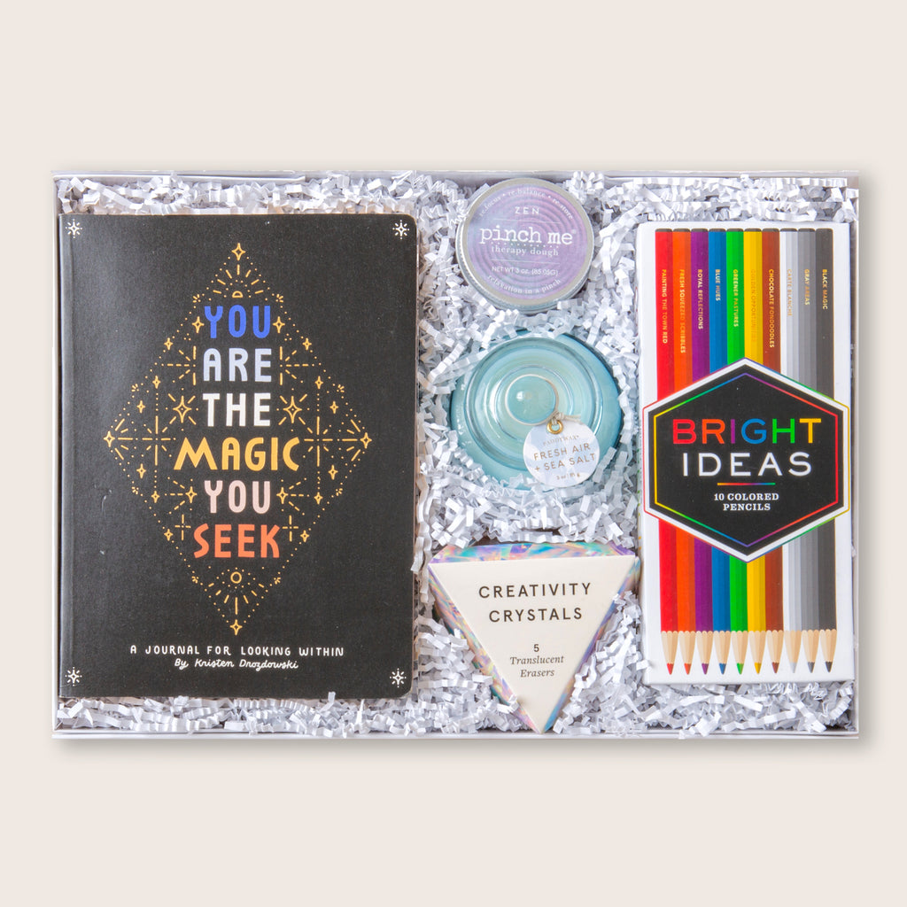 Gift set with inspirational journal, scented candle, therapy dough, colored pencils and "creativity crystals" eraser set.
